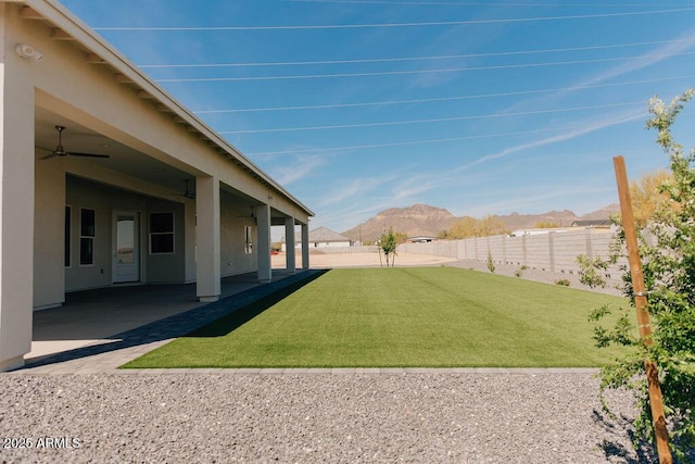 1229 N 106th Pl, Mesa, AZ 85207 - view of yard featuring a mountain view, a patio, and a ceiling fan