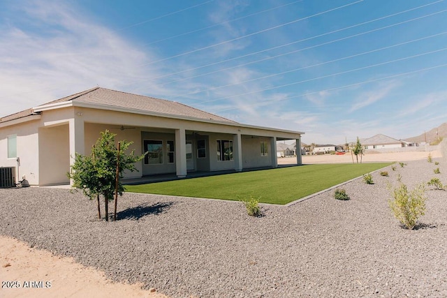 1229 N 106th Pl, Mesa, AZ 85207 - back of house with a yard, stucco siding, cooling unit, and a tiled roof