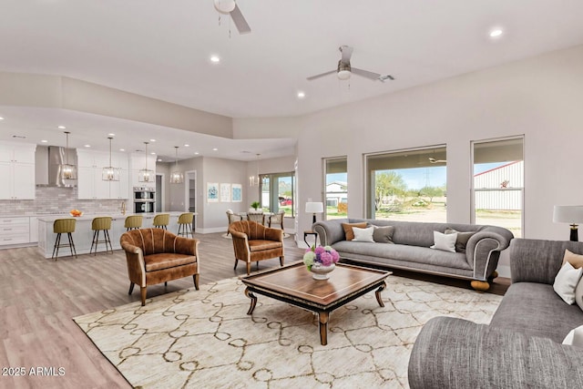 1229 N 106th Pl, Mesa, AZ 85207 - living area with a ceiling fan, recessed lighting, light wood-style floors, and baseboards