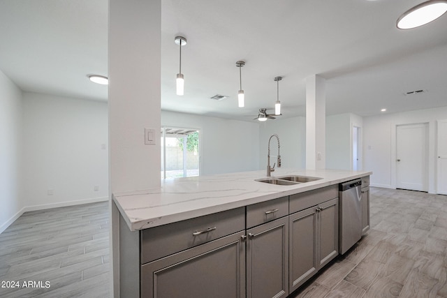 kitchen featuring light stone counters, ceiling fan, sink, dishwasher, and light wood-type flooring