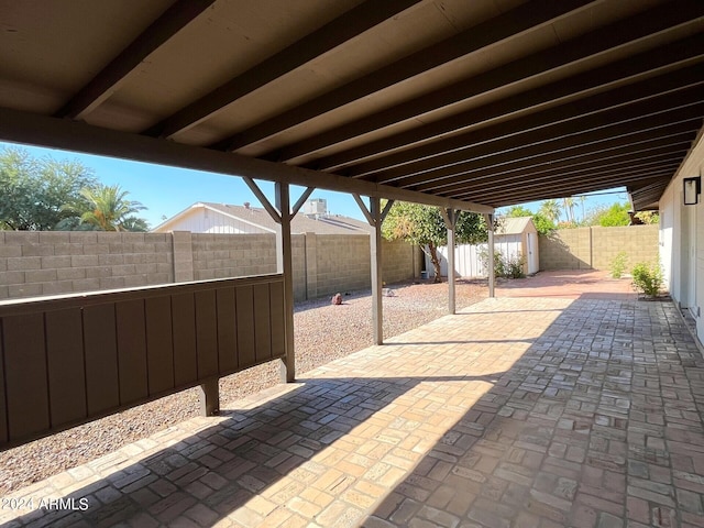 view of terrace featuring a storage unit