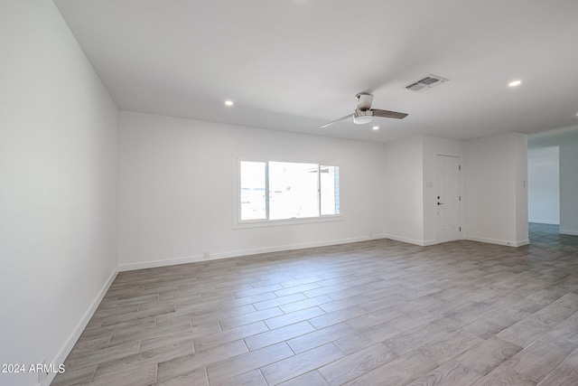 empty room featuring light hardwood / wood-style floors and ceiling fan