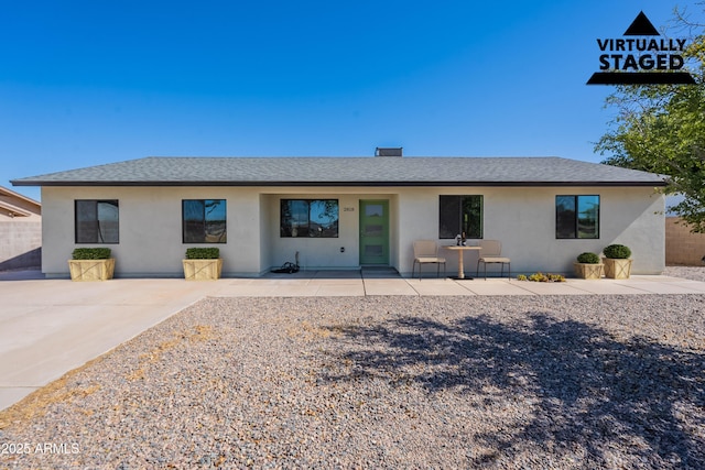 2818 E Villa Rita Dr, Phoenix, AZ 85032 - view of front facade featuring stucco siding, a patio, and a shingled roof