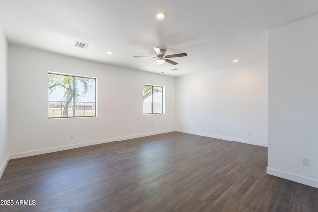 2818 E Villa Rita Dr, Phoenix, AZ 85032 - unfurnished room with a ceiling fan, dark wood-type flooring, recessed lighting, and baseboards