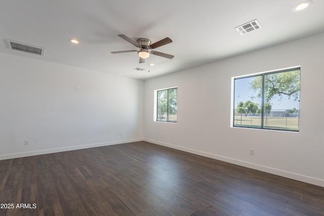 2818 E Villa Rita Dr, Phoenix, AZ 85032 - spare room with recessed lighting, ceiling fan, baseboards, and dark wood-type flooring