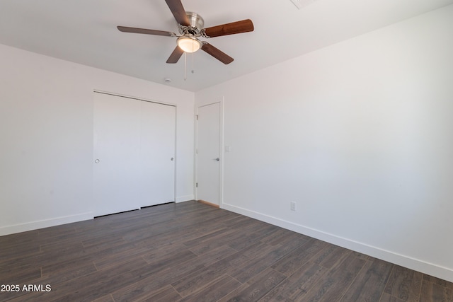 2818 E Villa Rita Dr, Phoenix, AZ 85032 - unfurnished bedroom featuring dark wood finished floors, baseboards, a closet, and a ceiling fan