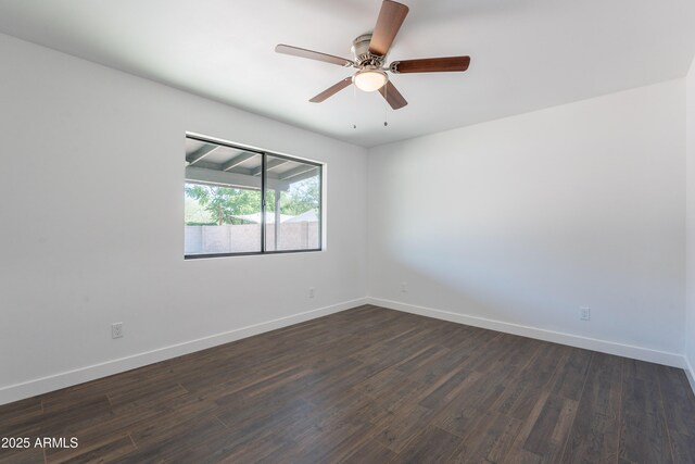 2818 E Villa Rita Dr, Phoenix, AZ 85032 - spare room featuring dark wood-style flooring, baseboards, and a ceiling fan
