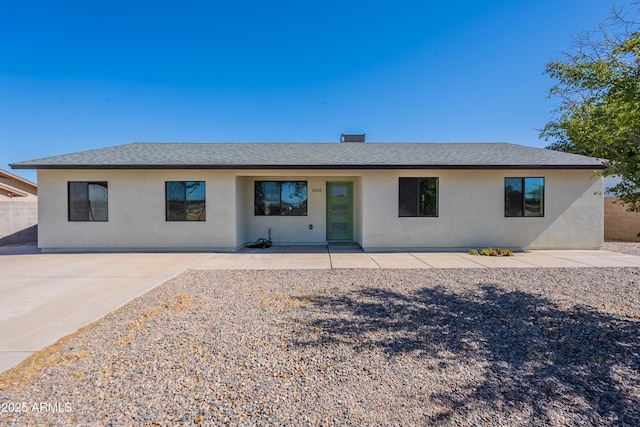 2818 E Villa Rita Dr, Phoenix, AZ 85032 - rear view of property featuring stucco siding, a patio area, and roof with shingles
