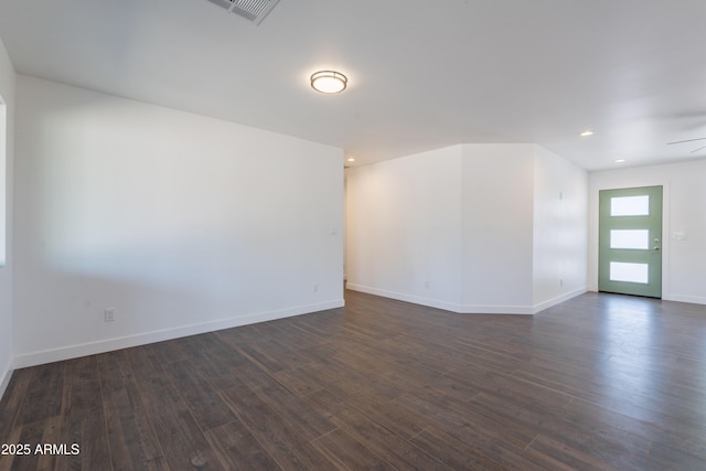 2818 E Villa Rita Dr, Phoenix, AZ 85032 - empty room featuring dark wood-style flooring, baseboards, and recessed lighting
