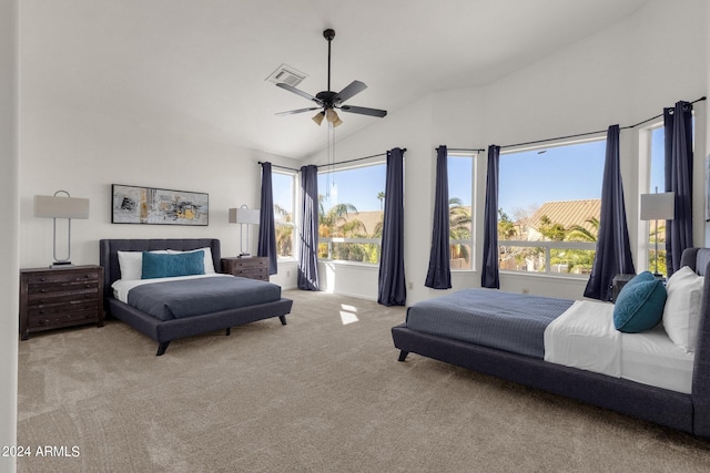 bedroom featuring lofted ceiling, carpet, visible vents, and a ceiling fan