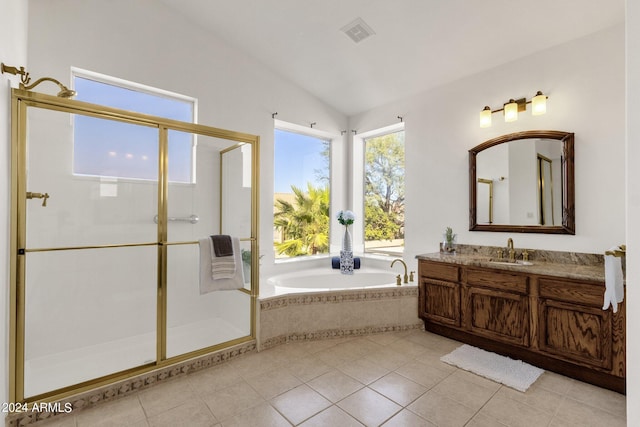 bathroom with vaulted ceiling, a bath, vanity, visible vents, and a stall shower
