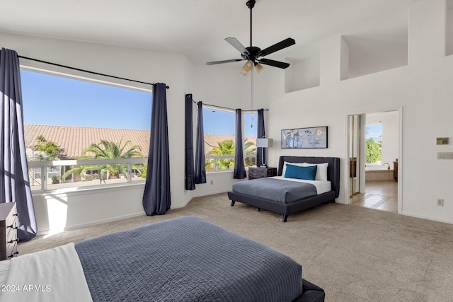 carpeted bedroom with baseboards, high vaulted ceiling, and multiple windows