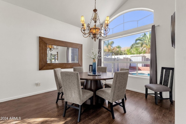 dining room with a chandelier, baseboards, dark wood-type flooring, and high vaulted ceiling