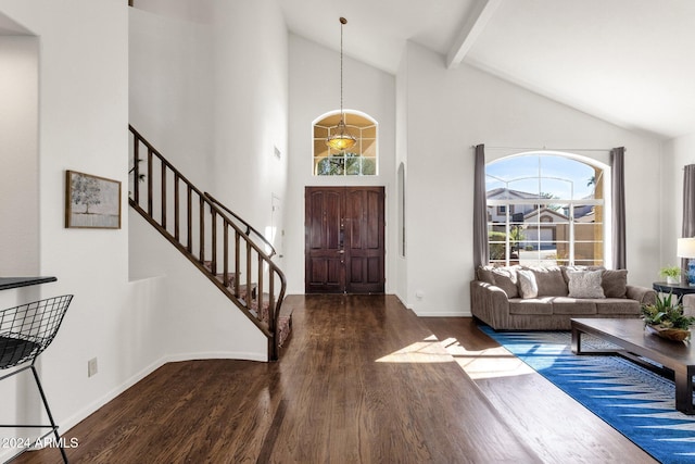 foyer entrance featuring wood finished floors, stairway, beamed ceiling, baseboards, and high vaulted ceiling