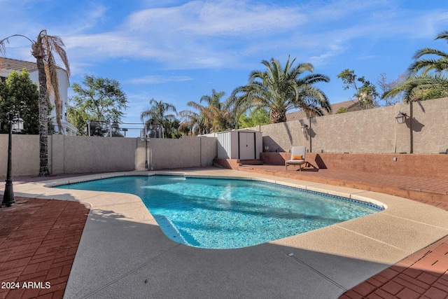 view of pool with a fenced backyard, a fenced in pool, and a patio area