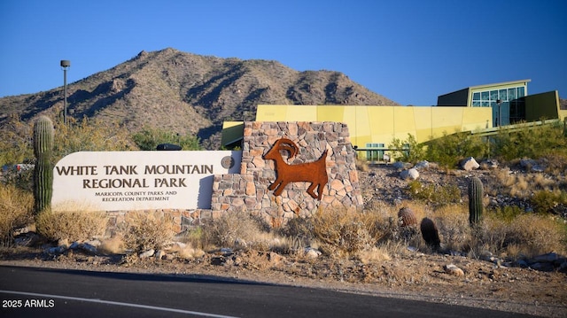 community sign featuring a mountain view