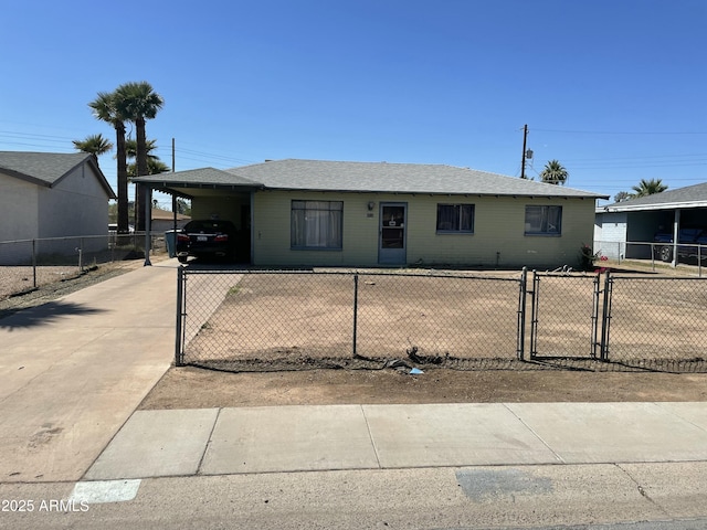 view of front facade with a gate, concrete driveway, and a carport