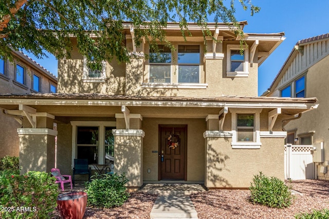 942 S Deerfield Ln, Gilbert, AZ 85296 - view of front facade with stucco siding and covered porch
