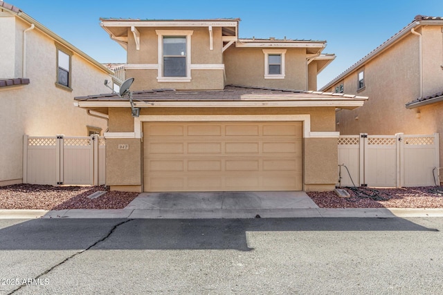 942 S Deerfield Ln, Gilbert, AZ 85296 - view of front facade with stucco siding, a garage, a gate, and driveway