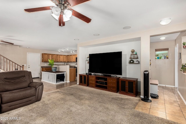 942 S Deerfield Ln, Gilbert, AZ 85296 - living area featuring ceiling fan, light tile patterned flooring, and stairs