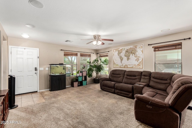942 S Deerfield Ln, Gilbert, AZ 85296 - living room featuring light colored carpet, ceiling fan, and light tile patterned floors