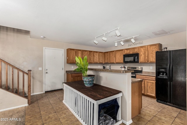 942 S Deerfield Ln, Gilbert, AZ 85296 - kitchen with black appliances, light tile patterned floors, brown cabinetry, and a kitchen island