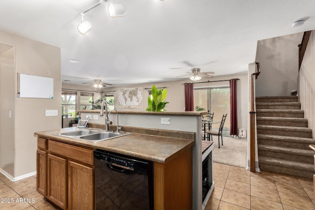 942 S Deerfield Ln, Gilbert, AZ 85296 - kitchen with black dishwasher, a ceiling fan, light tile patterned floors, and plenty of natural light