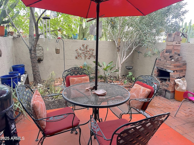 4201 E Camelback Rd Unit 51, Phoenix, AZ 85018 - fenced backyard with outdoor dining area and a patio area
