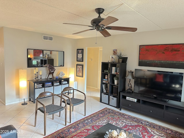 4201 E Camelback Rd Unit 51, Phoenix, AZ 85018 - living area with light tile patterned flooring, a ceiling fan, and baseboards