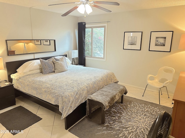 4201 E Camelback Rd Unit 51, Phoenix, AZ 85018 - bedroom featuring light tile patterned floors and a ceiling fan