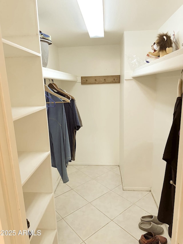 4201 E Camelback Rd Unit 51, Phoenix, AZ 85018 - walk in closet featuring tile patterned flooring