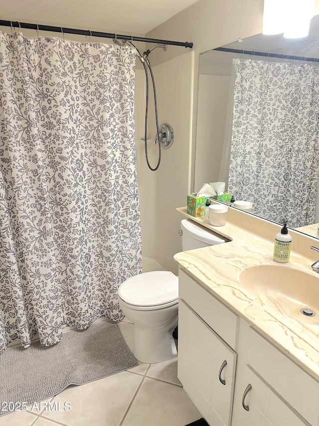 4201 E Camelback Rd Unit 51, Phoenix, AZ 85018 - bathroom with vanity, toilet, tile patterned flooring, and a shower with curtain