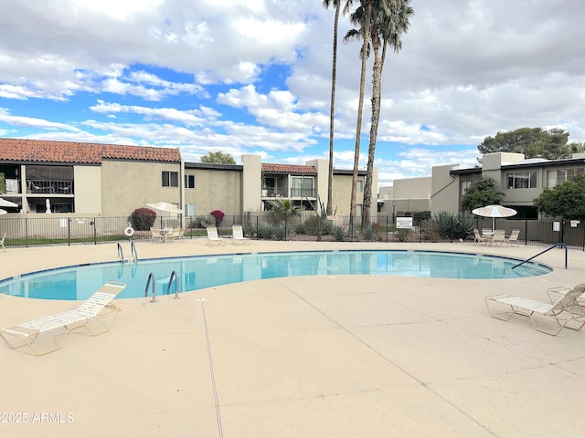 4201 E Camelback Rd Unit 51, Phoenix, AZ 85018 - community pool featuring a patio