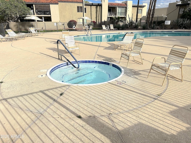 4201 E Camelback Rd Unit 51, Phoenix, AZ 85018 - community pool featuring a hot tub and a patio area