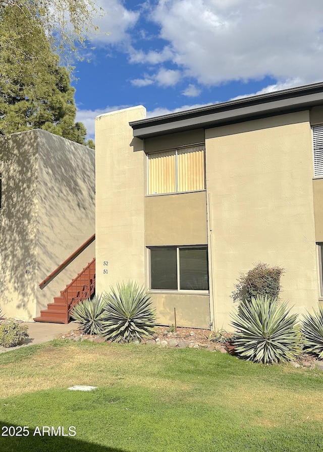 4201 E Camelback Rd Unit 51, Phoenix, AZ 85018 - view of property exterior featuring a yard