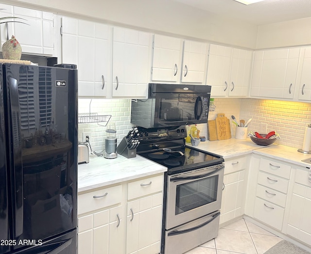 4201 E Camelback Rd Unit 51, Phoenix, AZ 85018 - kitchen with black appliances, tasteful backsplash, white cabinetry, light tile patterned flooring, and light stone counters