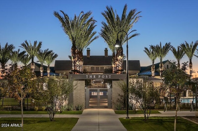 view of outdoor building at dusk