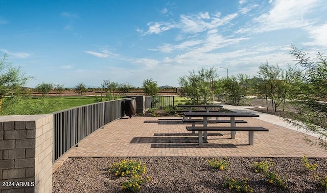 view of property's community with a patio area