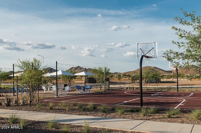 view of basketball court featuring a mountain view