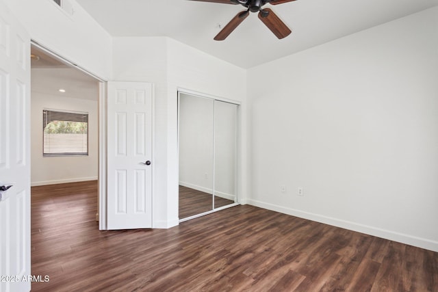15252 N 100th St Unit 1147, Scottsdale, AZ 85260 - unfurnished bedroom featuring dark wood-style floors, a closet, and a ceiling fan
