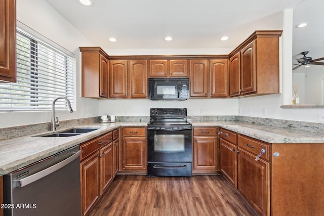 15252 N 100th St Unit 1147, Scottsdale, AZ 85260 - kitchen featuring black appliances, dark wood-style flooring, plenty of natural light, light stone countertops, and recessed lighting