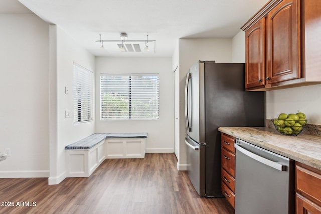 15252 N 100th St Unit 1147, Scottsdale, AZ 85260 - kitchen with appliances with stainless steel finishes, dark wood-style flooring, light stone countertops, and track lighting