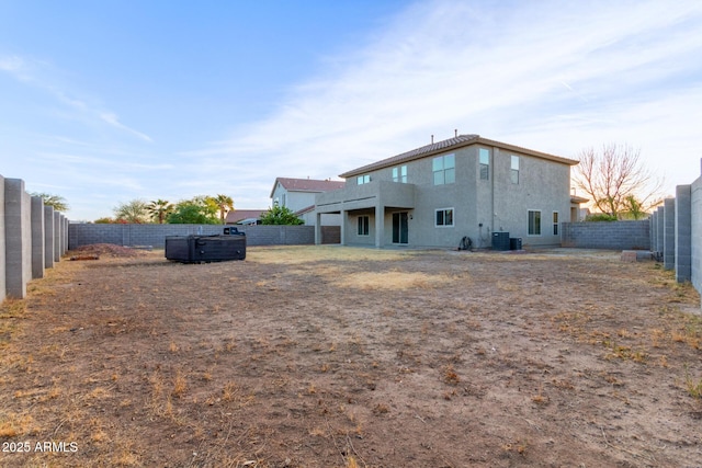 32211 N Lepa Dr, San Tan Valley, AZ 85144 - back of house with central AC, a fenced backyard, and stucco siding