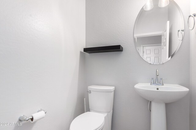 bathroom featuring sink and toilet