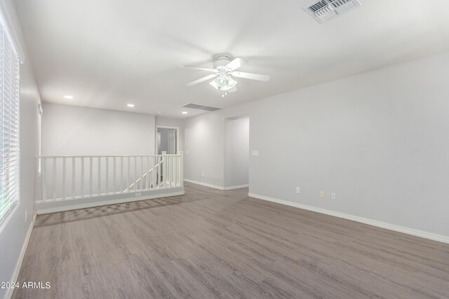 spare room featuring hardwood / wood-style floors and ceiling fan