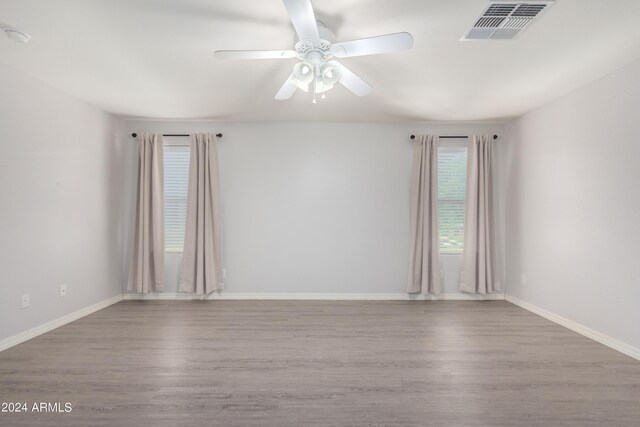 unfurnished room featuring ceiling fan and light hardwood / wood-style floors