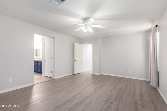 empty room featuring light hardwood / wood-style floors and ceiling fan