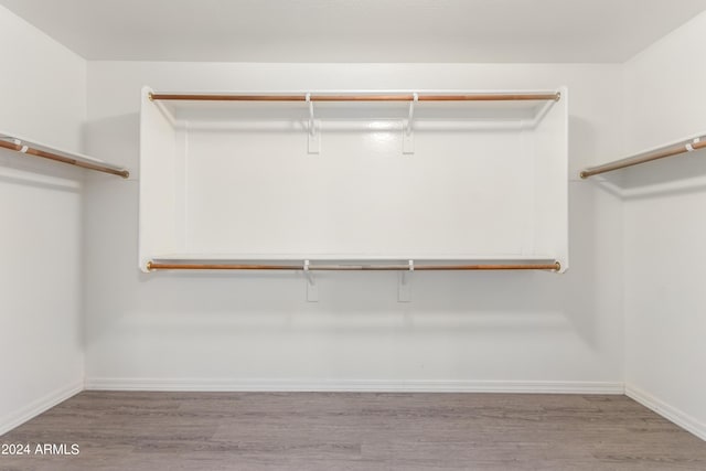 walk in closet featuring light hardwood / wood-style floors