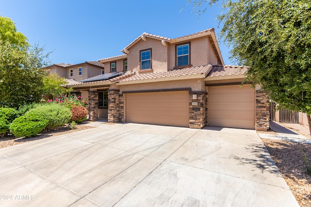 mediterranean / spanish-style house featuring a garage