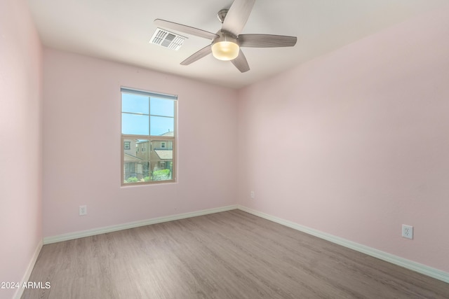 unfurnished room featuring ceiling fan and light hardwood / wood-style floors